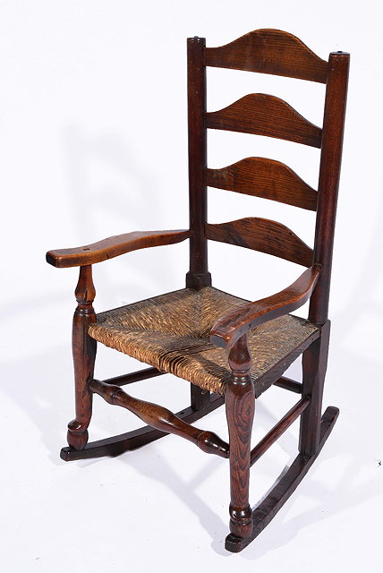 Appraisal: Early th Century oak child's rocking chairwith rush seat on