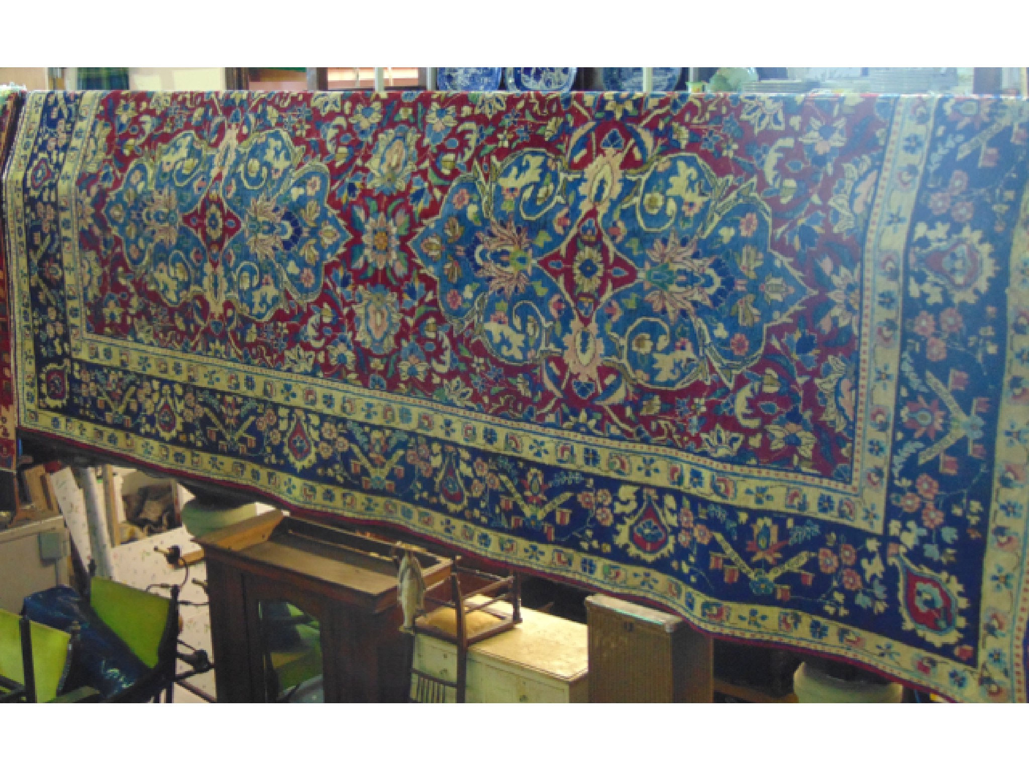 Appraisal: A substantial Persian style wool work carpet the central blue