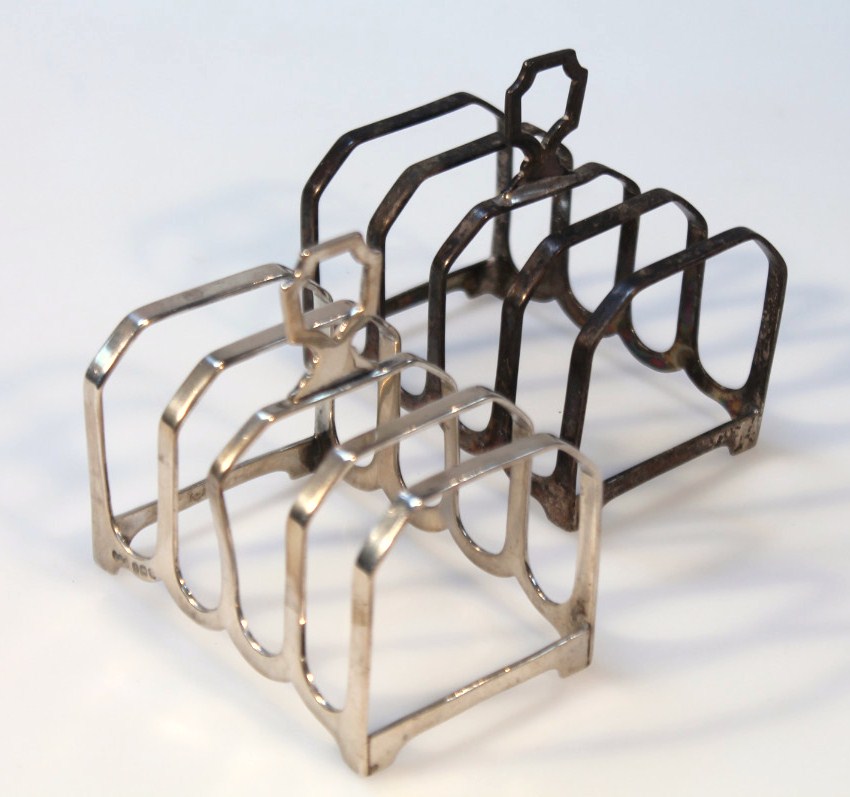 Appraisal: A pair of George V silver five-bar toast racks Birmingham