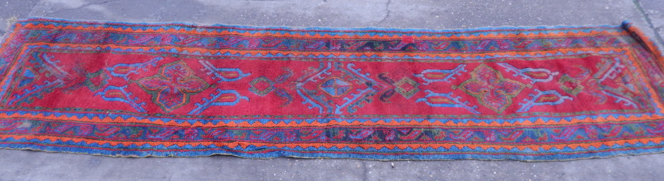 Appraisal: A Turkey rug of typical form with geometric devices on