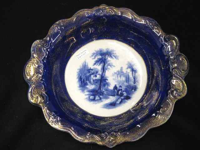 Appraisal: Flow Blue Ironstone Serving Bowl landscape with villagers gold trim