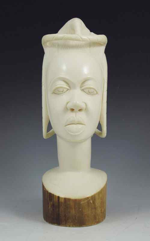 Appraisal: AFRICAN CARVED IVORY PORTRAIT BUST Carved from a single trunk