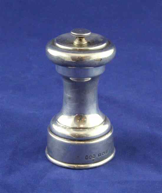 Appraisal: A George V silver pepper mill of waisted form Hukin