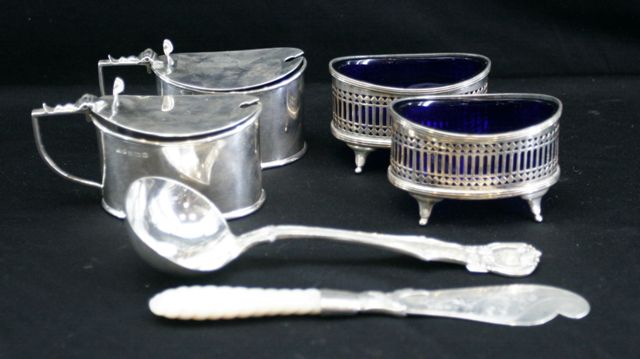 Appraisal: A pair of sterling silver salt cellars with cobalt glass