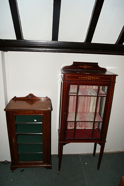 Appraisal: AN EDWARDIAN STAINED MAHOGANY DISPLAY CABINET cm wide and a