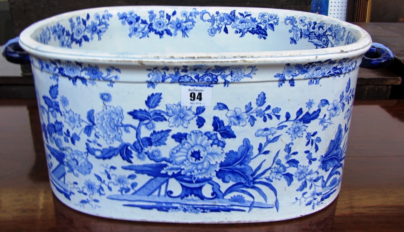 Appraisal: A Victorian pottery two- handled footbath printed with blue flowers