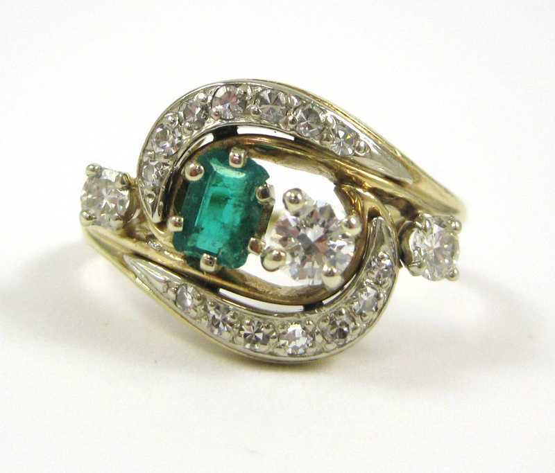 Appraisal: EMERALD DIAMOND AND FOURTEEN KARAT GOLD RING with round-cut diamonds