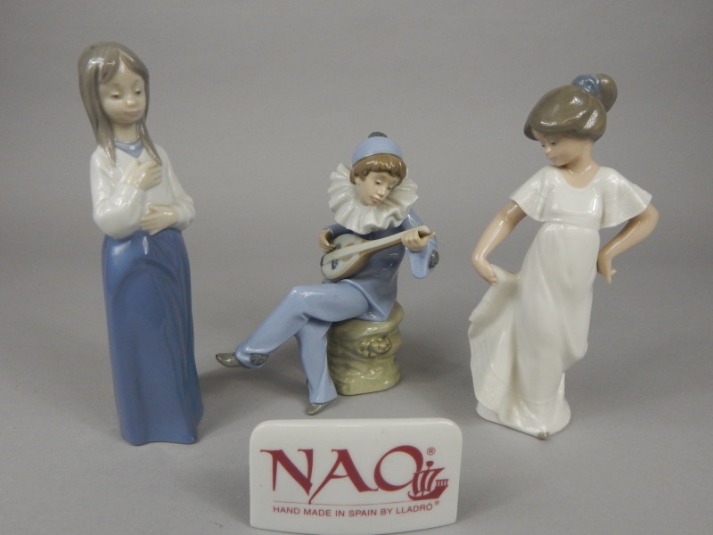 Appraisal: Three Nao porcelain figures and a plaque one in the