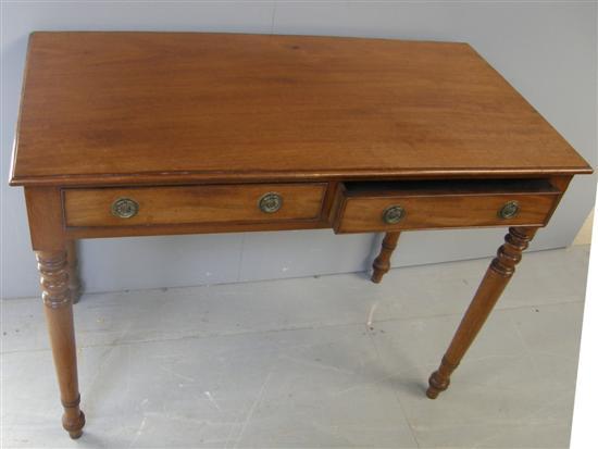 Appraisal: th century mahogany side table with two drawers on turned