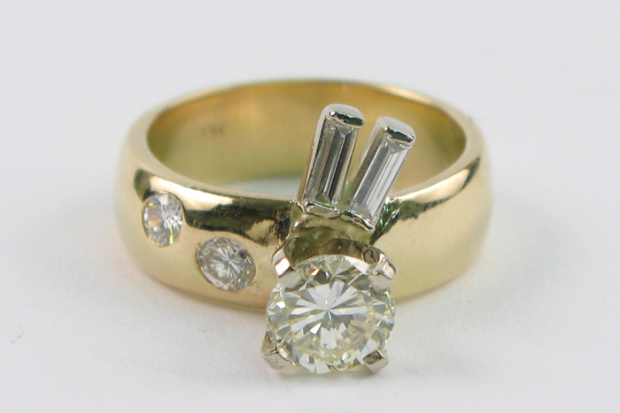 Appraisal: DIAMOND AND FOURTEEN KARAT GOLD RING centering around brilliant-cut diamond