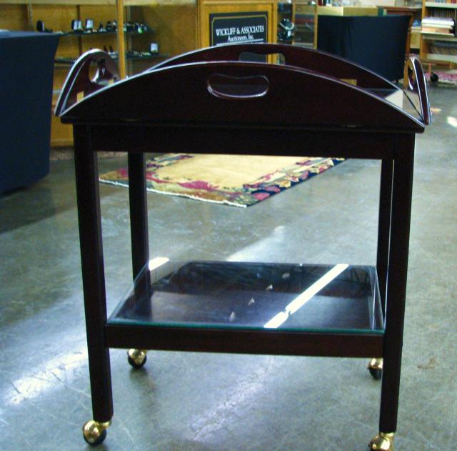 Appraisal: Mahogany Butlers Style Rolling Tea Cart with brass castors and