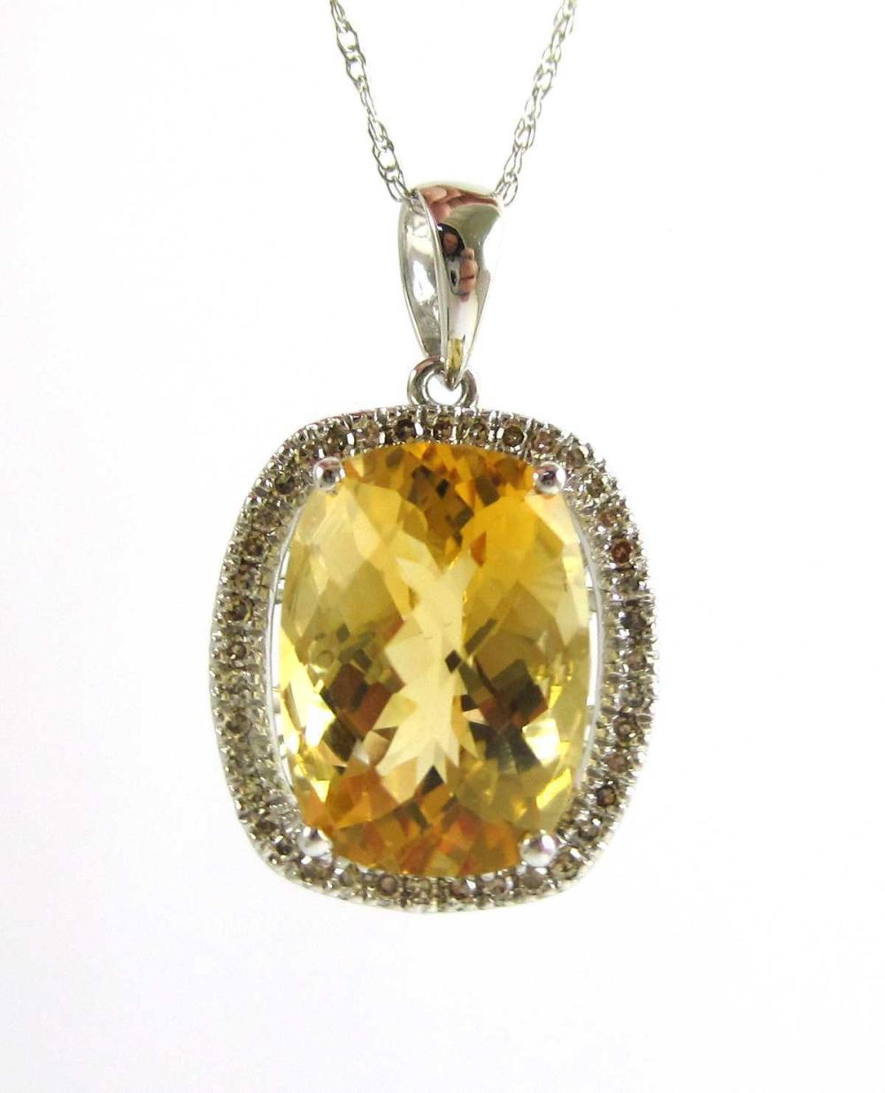 Appraisal: CITRINE DIAMOND AND FOURTEEN KARAT GOLD PENDANT NECKLACE with an