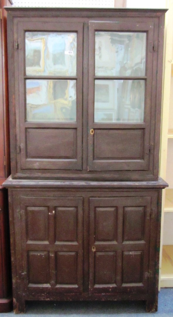 Appraisal: A th century painted pine housekeepers cupboard with pair of