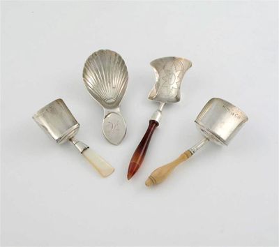 Appraisal: Four various caddy spoons a George III fluted spoon initialled