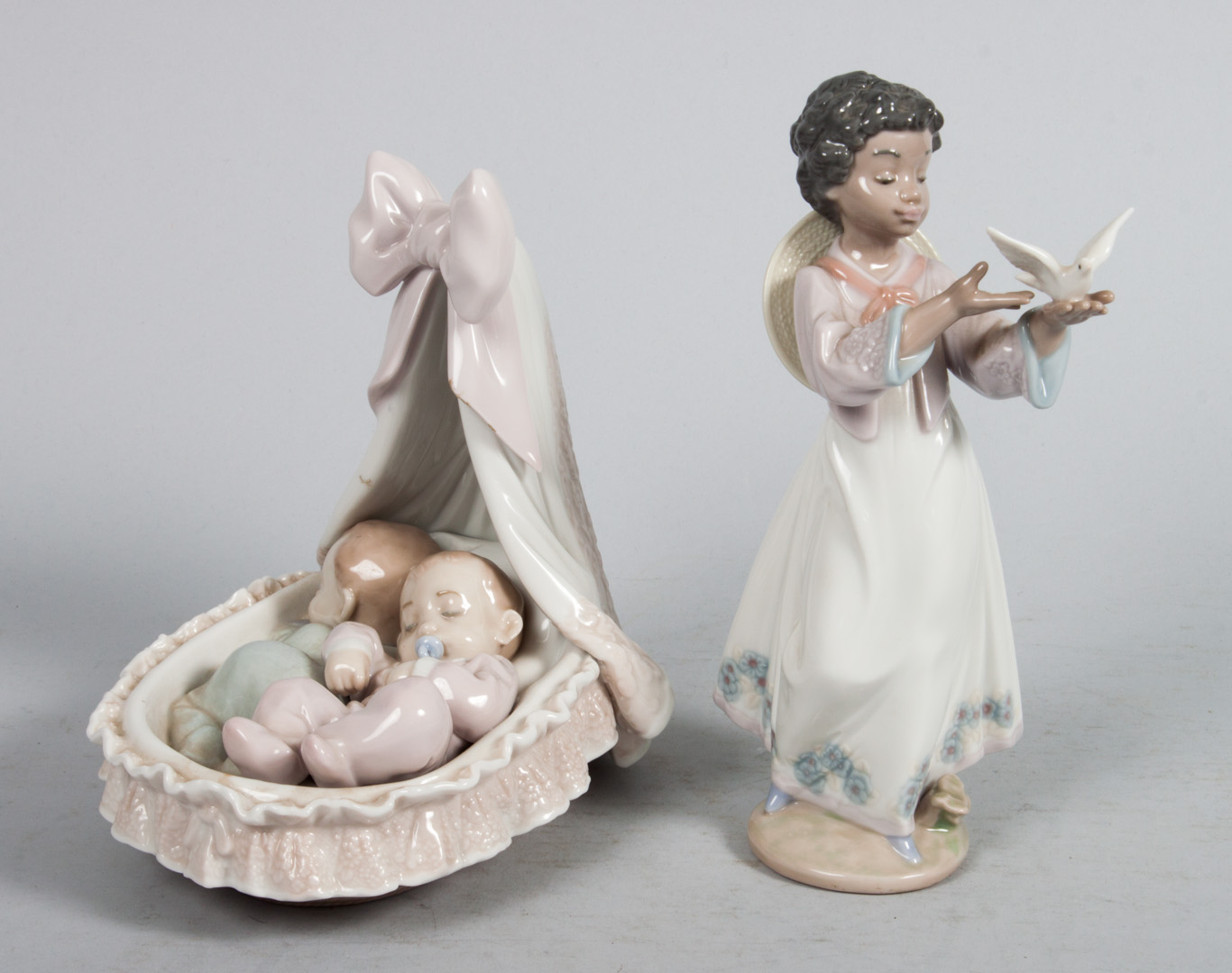 Appraisal: Two Lladro porcelain figures African Love in and Sweet Dreamers