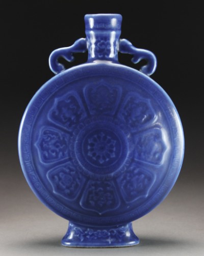 Appraisal: Convex sides molded with eight petals enclosing the bajixiang radiating