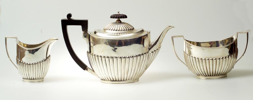 Appraisal: VICTORIAN SILVER THREE-PIECE TEASET ROBERTS BELK SHEFFIELD comprising teapot cream