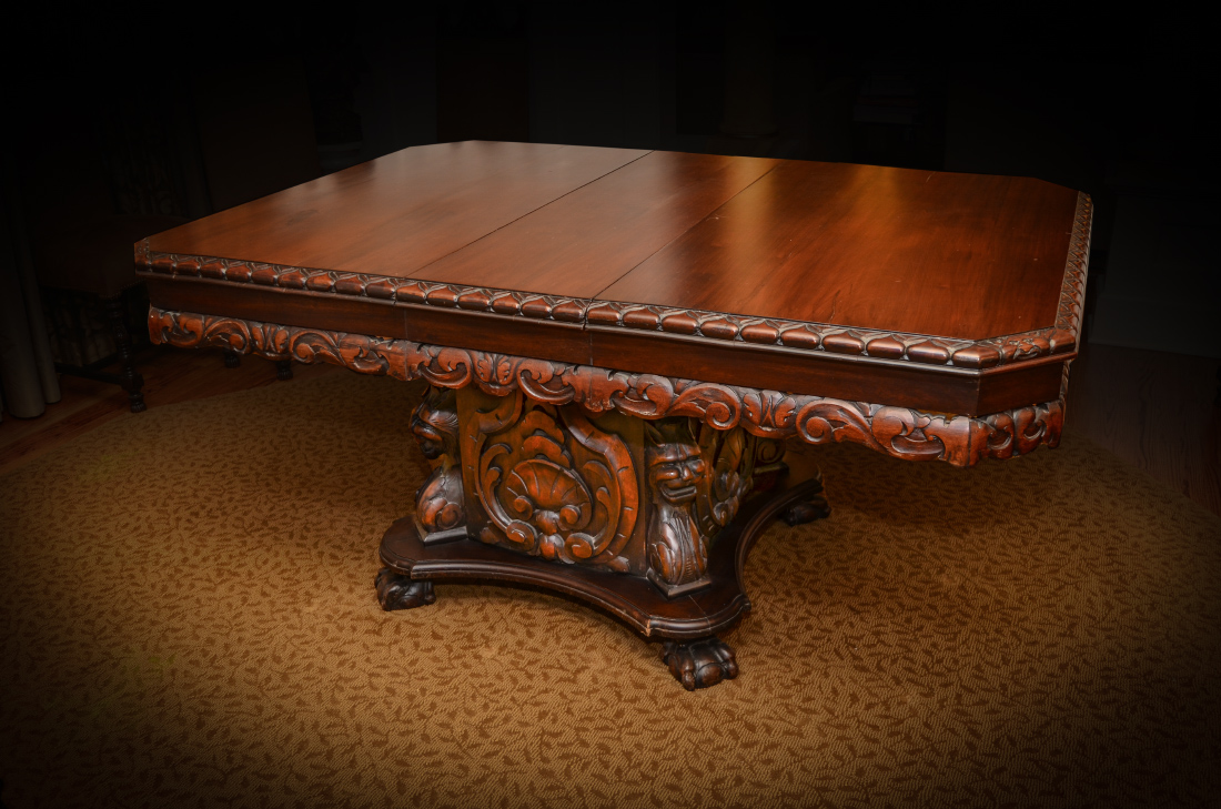 Appraisal: CARVED VICTORIAN EXPANDING DINING TABLE Top with canted corners carved