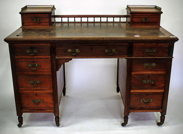 Appraisal: AN EDWARDIAN MAHOGANY LADIES WRITING DESK with a brown leather