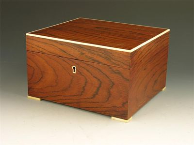 Appraisal: A rosewood and ivory mounted rectangular humidor with a cedar