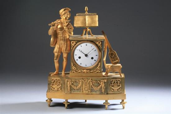 Appraisal: EMPIRE-STYLE BRONZE-DOR FIGURAL MANTLE CLOCK Circa Shaped rectangular base the