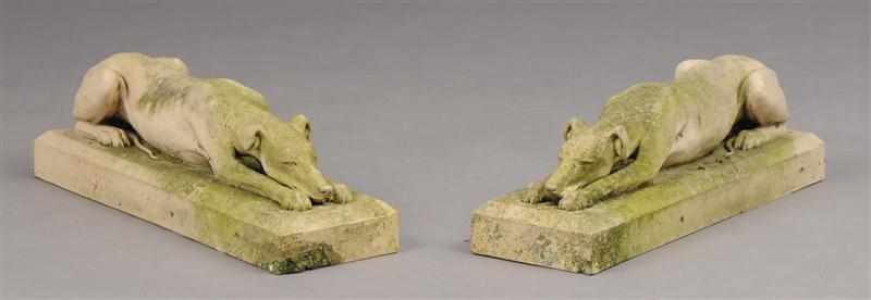 Appraisal: PAIR OF CAST-STONE GARDEN STATUES Each cast as a recumbent