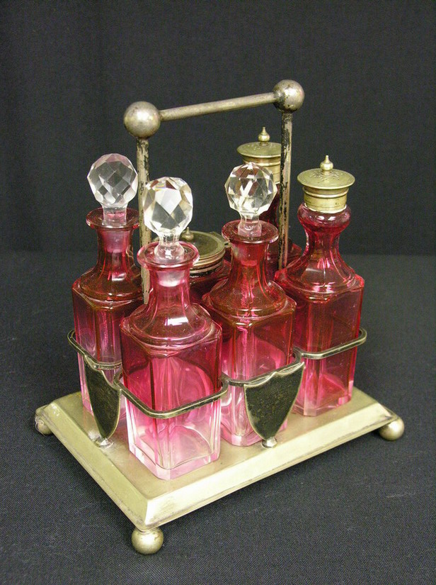 Appraisal: CRANBERRY CONDIMENT SET base is marked E P N S