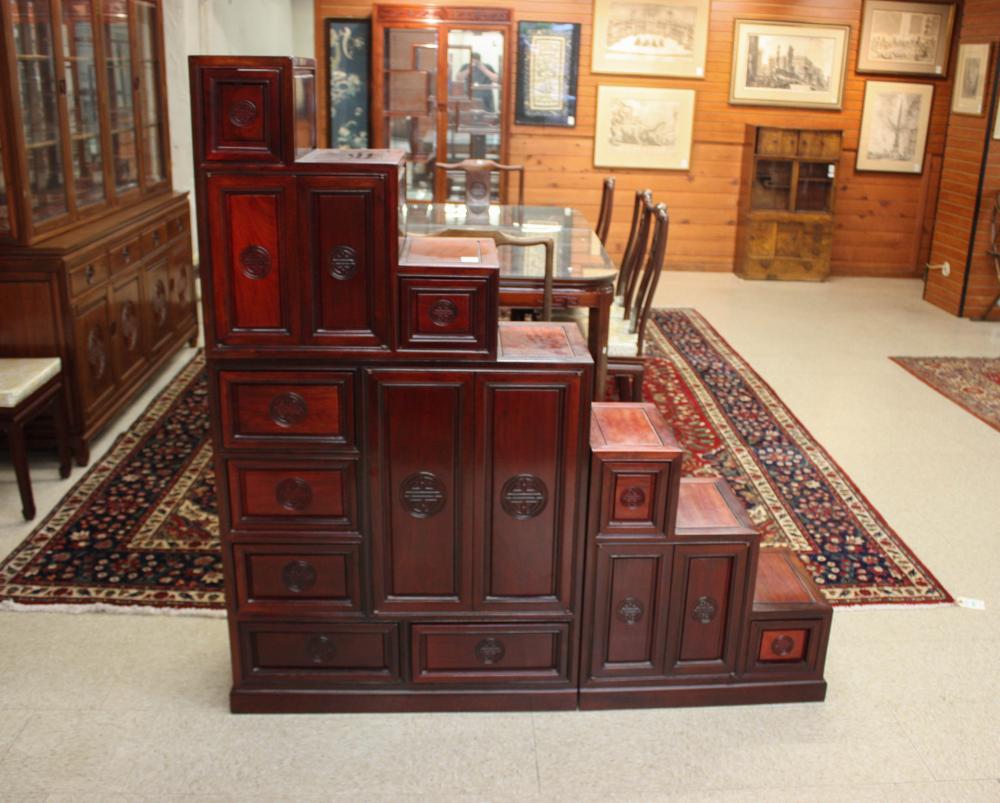 Appraisal: THREE-PART CHINESE ROSEWOOD STAIRCASE CHEST having a seven-step top along