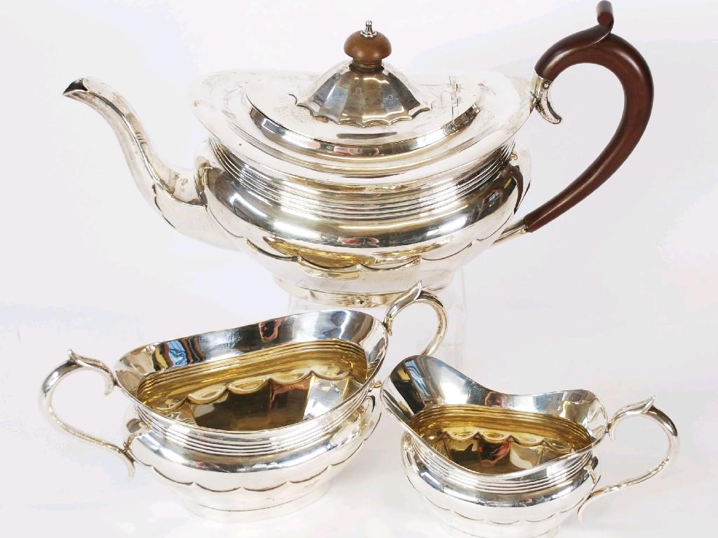 Appraisal: GEORGE V THREE PIECE SILVER TEA SET oval part panelled