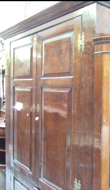 Appraisal: A George III oak and elm livery cupboard the pair