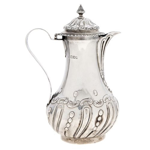 Appraisal: An Edwardian silver lidded jug in George II style with