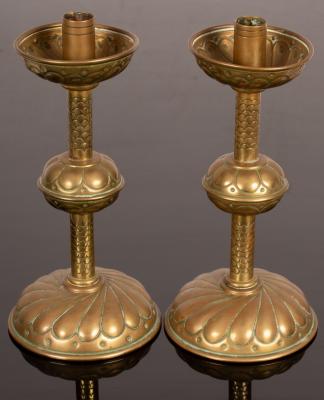 Appraisal: A pair of copper and brass candlesticks with lobed and