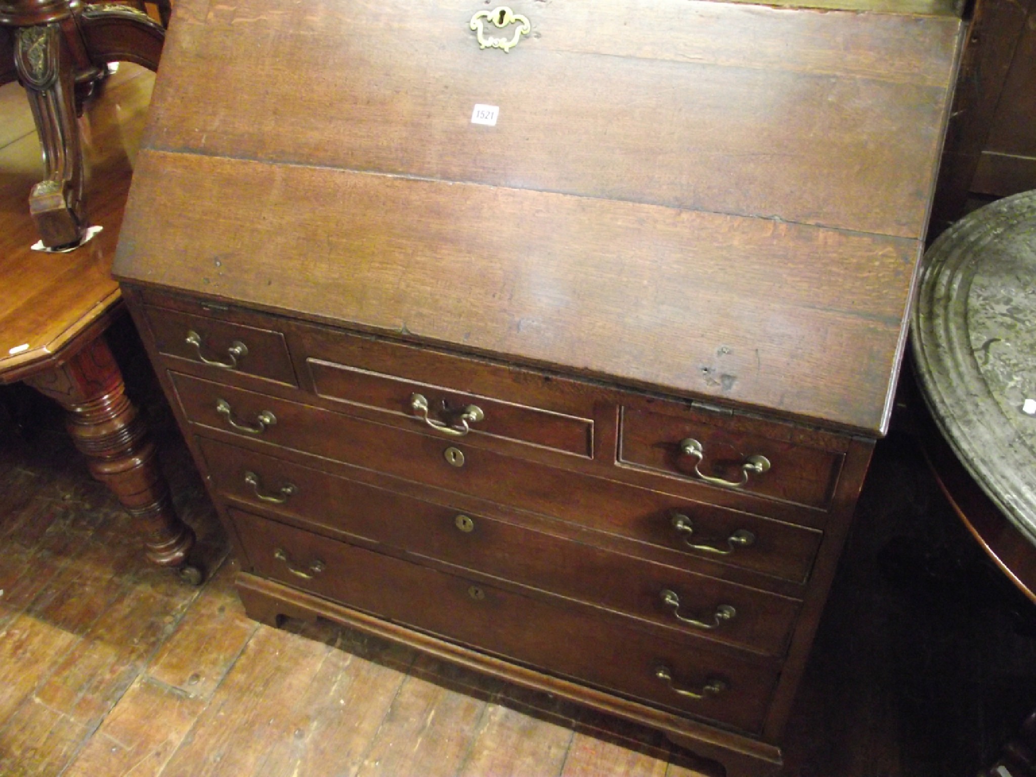 Appraisal: A Georgian country made oak bureau of three long and