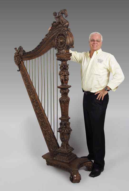 Appraisal: CARVED MAHOGANY DECORATIVE HARP SCULPTURE Profusely carved with full body