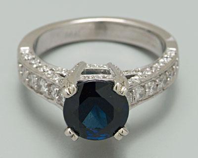 Appraisal: Sapphire diamond ring central round faceted blue sapphire estimated total