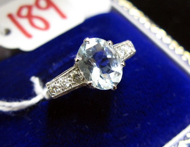 Appraisal: AQUAMARINE SAPPHIRE DIAMOND AND EIGTHEEN KARAT WHITE GOLD RING centering