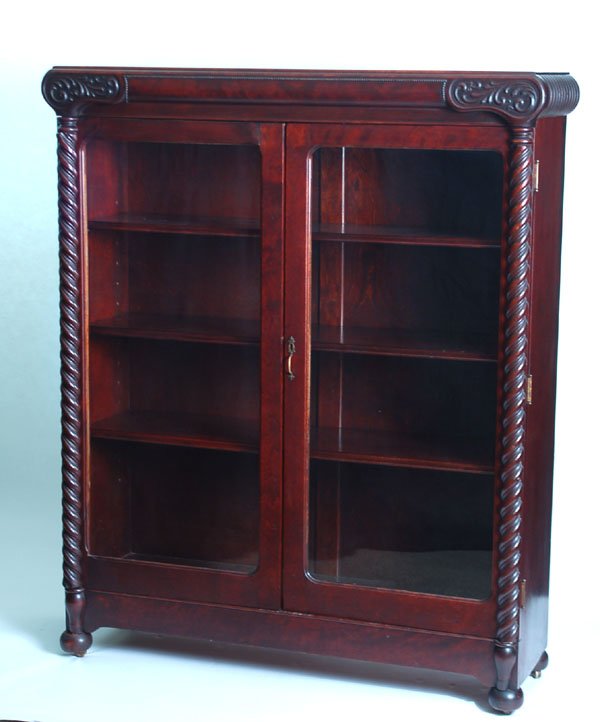 Appraisal: Circa mahogany bookcase with two glass front doors flanked by