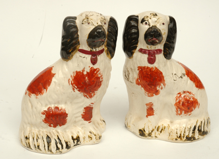 Appraisal: A PAIR OF TH CENTURY STAFFORDSHIRE SPANIELS