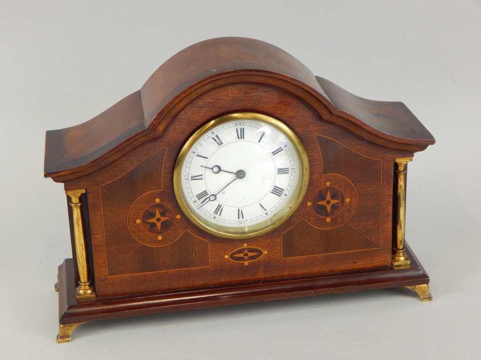 Appraisal: An Edwardian mahogany and marquetry mantel timepiece with white enamel