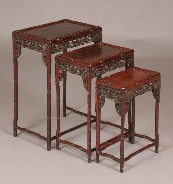 Appraisal: Set of teak nesting tables with carved floral aprons faux