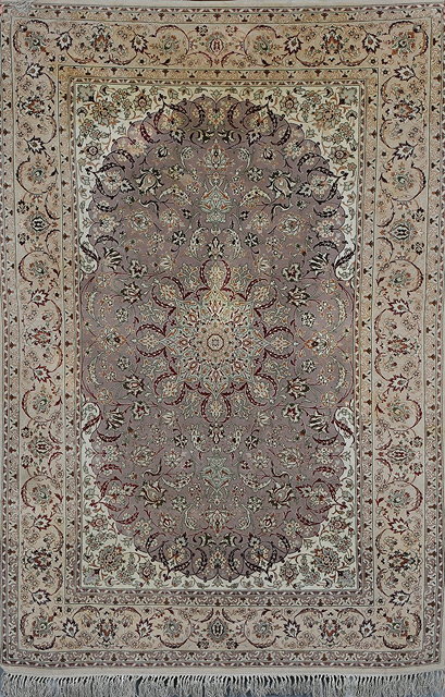 Appraisal: AN ISFAHAN PASTEL GROUND RUG with a central star medallion