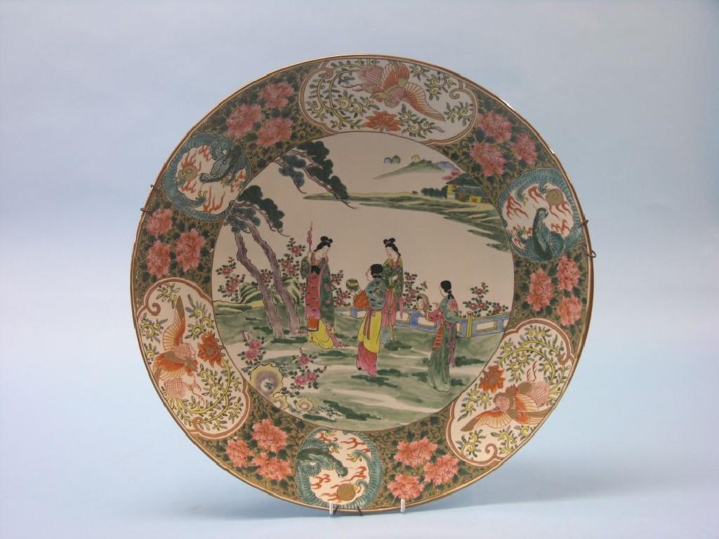 Appraisal: A large Canton porcelain wall plate painted with four female