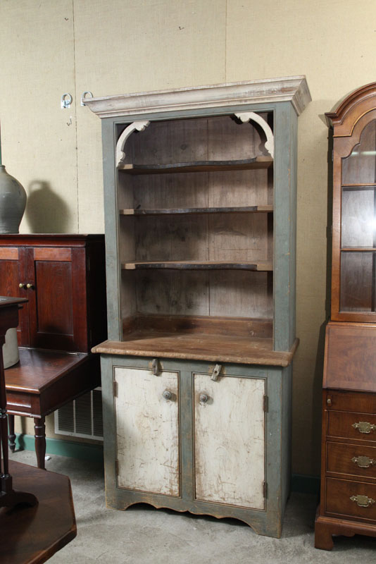 Appraisal: STEPBACK CUPBOARD Blue and white paint decorated cupboard with molded