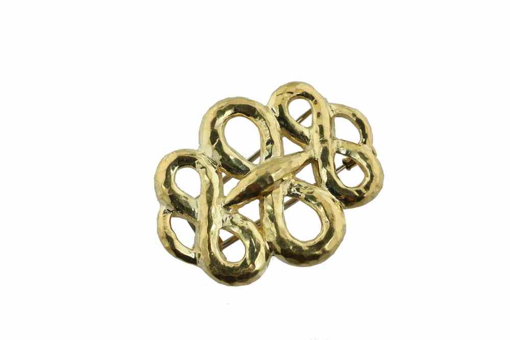 Appraisal: BROOCH - Hand hammered K yellow gold intertwined figure eight