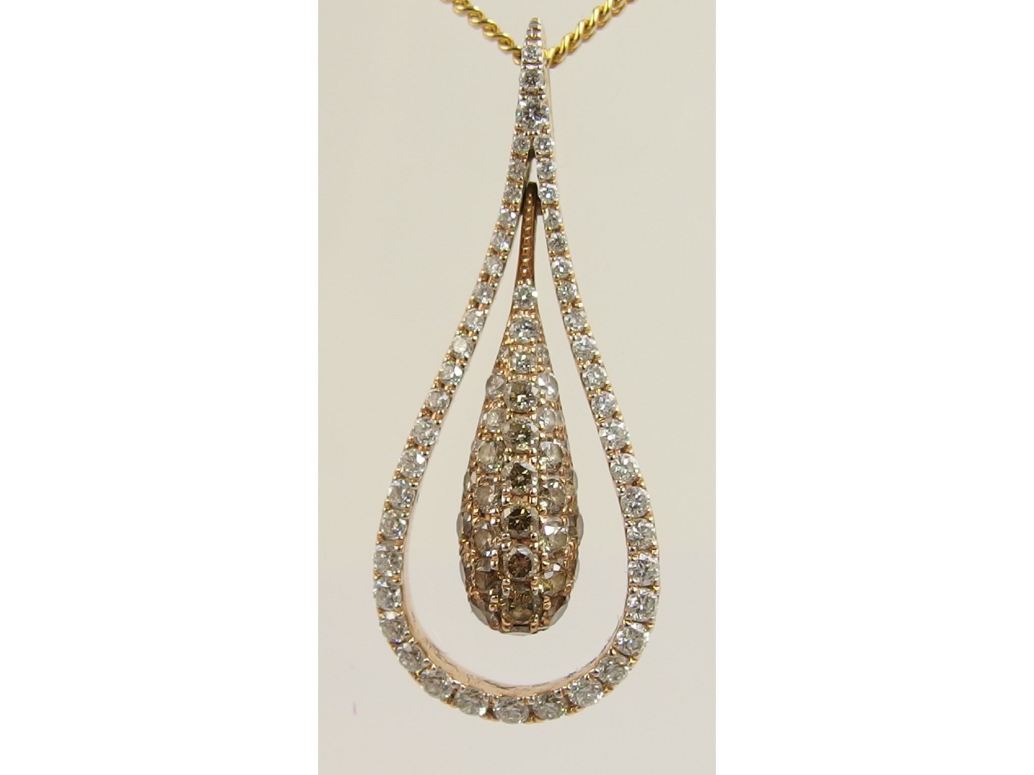 Appraisal: An ct diamond pendant of elegant drop shape pave set