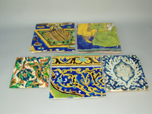 Appraisal: Three Persian terracotta tiles th century with polychrome figural painted