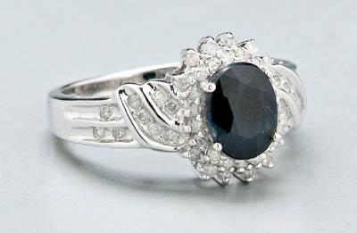 Appraisal: Lady's sapphire and diamond ring one oval faceted dark blue