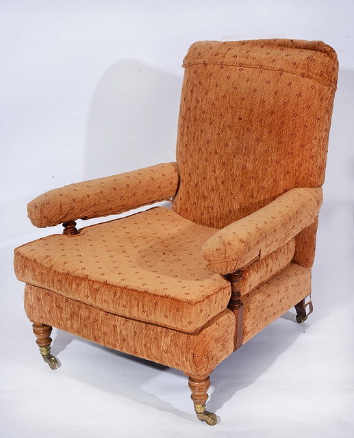 Appraisal: A HOWARD SONS LIBRARY ARMCHAIR with loose cushion and pattern