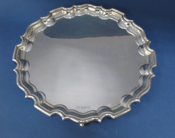 Appraisal: A SALVER of shaped circular form with a raised castellated