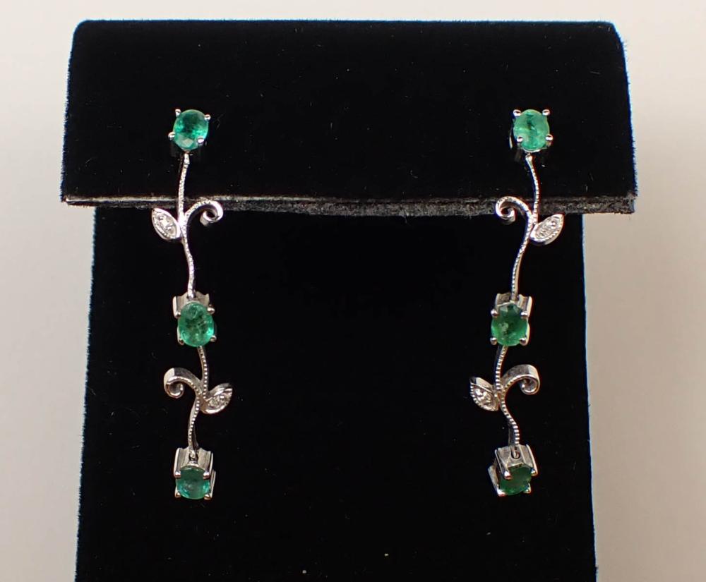 Appraisal: PAIR OF EMERALD AND DIAMOND DANGLE EARRINGS each k white